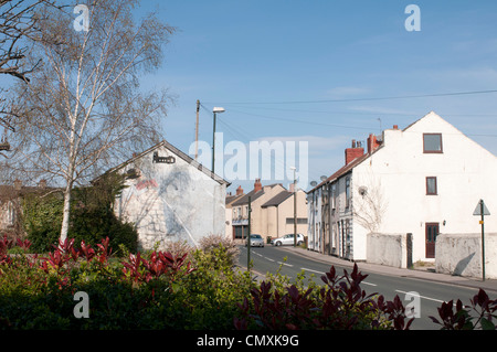 L'homme avec le cochon sur le mur, Kippax (M. Kershaw) Banque D'Images