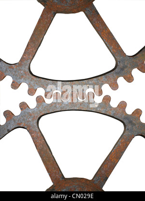 Rusty cogs sur un fond blanc. Banque D'Images