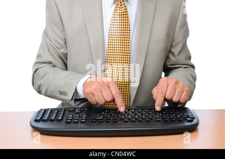 Libre d'un homme d'affaires de la saisie sur un clavier sans fil. Banque D'Images