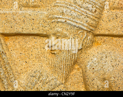 Native art sculpté sur le mur dans le temple. Banque D'Images