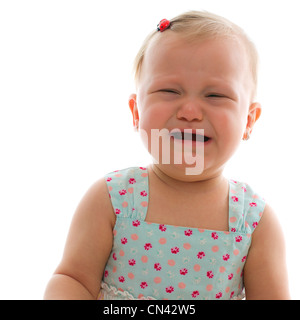 Crying baby girl - studio shot over white Banque D'Images