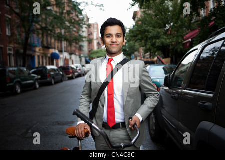 Businessman with bicycle Banque D'Images