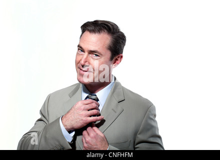 Businessman adjusting tie Banque D'Images