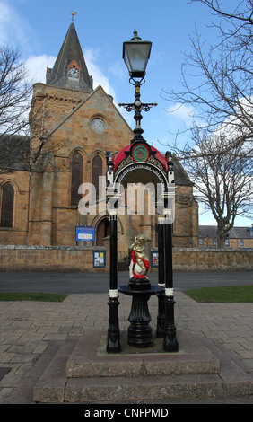 Fontaine de l'époque victorienne et la cathédrale de Dornoch ecosse mars 2012 Banque D'Images