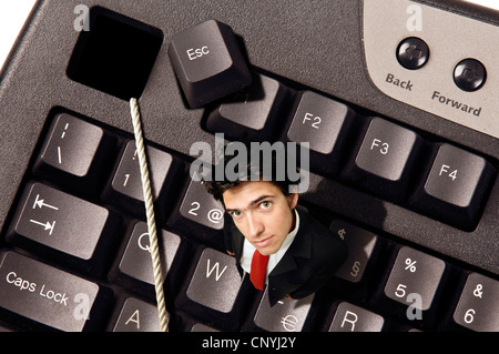 Businessman hors de la touche d'échappement dans un clavier d'ordinateur Banque D'Images