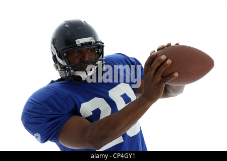Joueur de football tourné sur un fond blanc Banque D'Images
