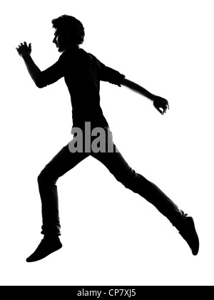 Jeune homme running silhouette en studio isolé sur fond blanc Banque D'Images