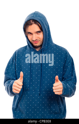 Portrait de jeunes heureux homme confiant en bleu hoodie gesturing Thumbs up, isolé sur fond blanc. Banque D'Images