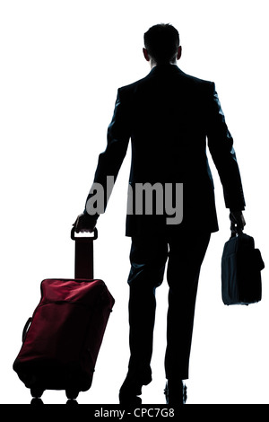 Vue arrière un caucasian business traveler homme marchant avec valise pleine longueur ossature en studio isolé sur fond blanc Banque D'Images