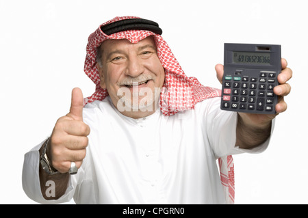 Mature man holding, showing Thumbs up, portrait Banque D'Images