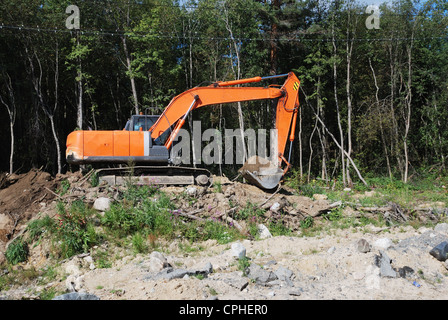 Earth Mover orange sur la scène de travail Banque D'Images