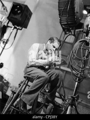 Paul Muni pendant le tournage de 'Hi, Nellie', 1934 Banque D'Images