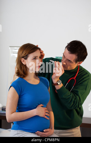 REFLEX SYMPT. Femme enceinte Banque D'Images