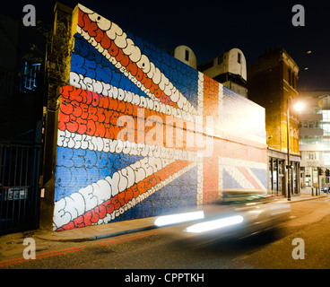 Grand Union Jack peint sur un mur de brique à Shoreditch, London, UK. Banque D'Images