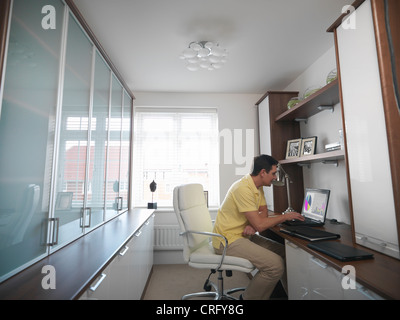Man working on laptop in office