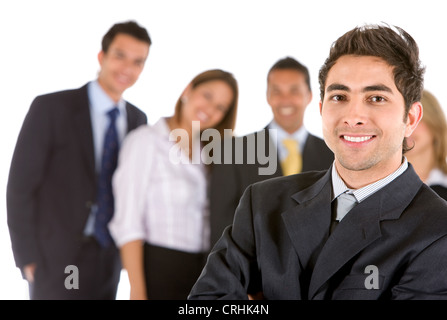 Young smiling businessman standing in front of his team Banque D'Images