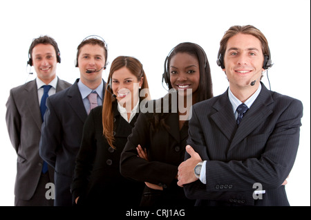 Rangée de smiling young people wearing headsets Banque D'Images