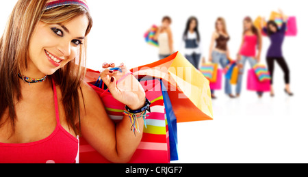 Woman smiling and carrying shopping bags Banque D'Images