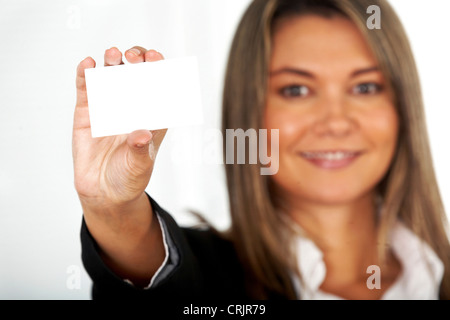 Beautiful businesswoman displaying her business card smiling Banque D'Images