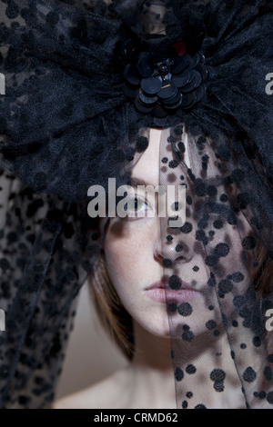 Close-up portrait of a young woman wearing black veil Banque D'Images