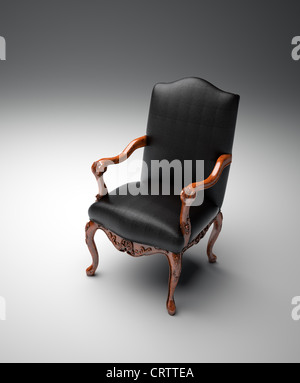 Un fauteuil en cuir noir vide Banque D'Images