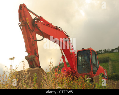 Machines de construction dans un champ dans l'après-midi. Banque D'Images