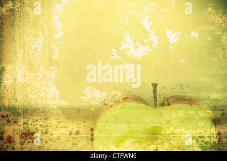 Art texture. Un résumé de fond, une pomme verte dans un style grunge Banque D'Images