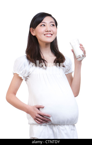 Femme enceinte avec du lait Banque D'Images