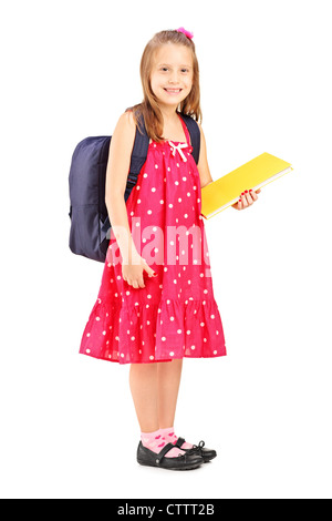 Portrait d'une école girl holding notebook, isolé sur fond blanc Banque D'Images