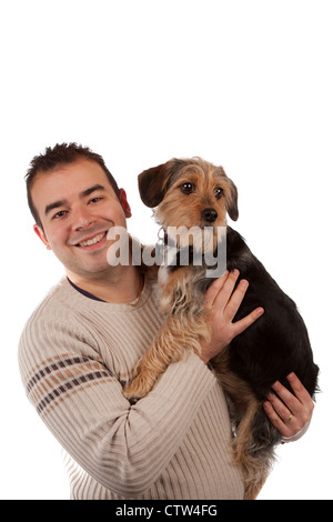 Portrait of a man holding a cute dog isolated over white. Banque D'Images