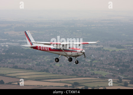 Cessna 152 en vol au dessus de North Norfolk Banque D'Images