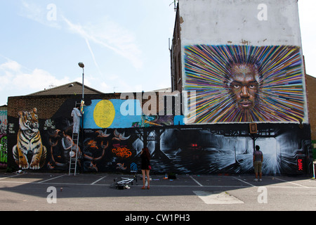 Fresque de sprinter Usain Bolt par James Cochran à la jonction de Sclater Street & Cygnet Street, Brick Lane Market, Londres, Royaume-Uni. Banque D'Images