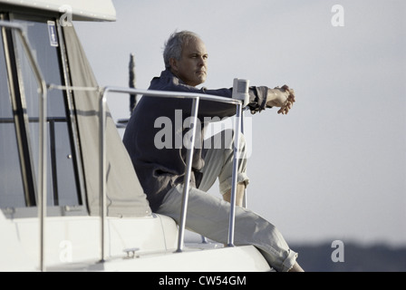 Senior man sitting on a boat Banque D'Images