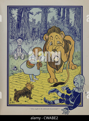 Wonderful Wizard of Oz personnages principaux, créé par Frank Lyman Baum en 1900. Dorothy parle à l'lion lâche. Banque D'Images