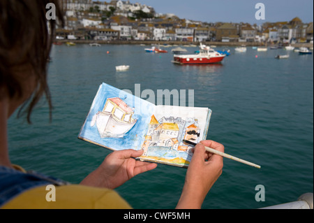 La peinture d'une femme ou le port port scène dans un livre de peinture à St Ives Cornwall Banque D'Images