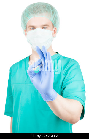 Chirurgien mâle montrant ok sign et isolated on white Banque D'Images