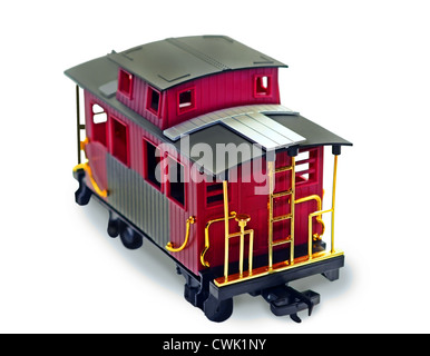 Un jouet en plastique lumineux caboose sur fond blanc. Banque D'Images