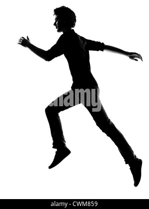 Jeune homme running silhouette en studio isolé sur fond blanc Banque D'Images