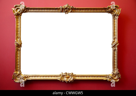 Photo gold frame sur mur peint rouge Banque D'Images