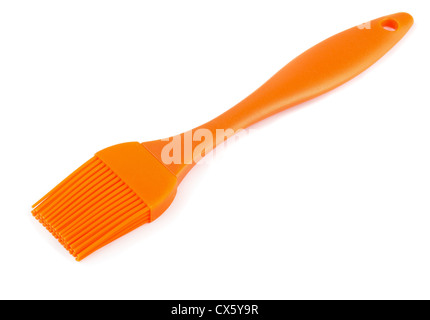 Pinceau à pâtisserie en silicone Orange isolated on white Banque D'Images