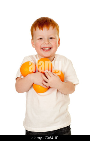 Enfant, garçon avec des oranges. mode de vie sain concept. Banque D'Images