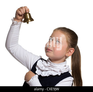 Jeune fille de l'école à la recherche de golden bell sur fond blanc Banque D'Images