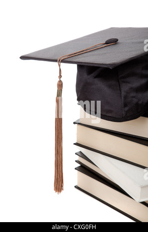 Graduation cap sur une pile de livres Banque D'Images