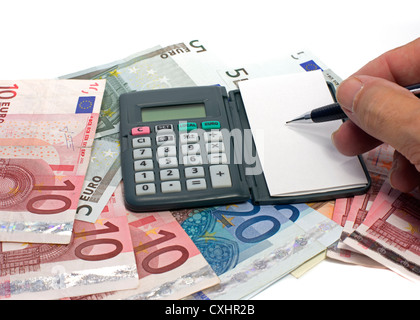 L'écriture et le calcul avec de l'argent euro Banque D'Images