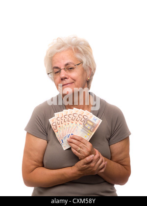 Happy mature woman holding argent (euro) Banque D'Images