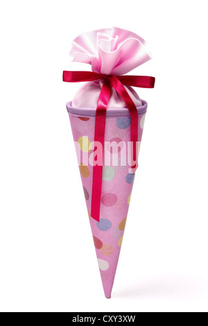 Schultuete ou cône rose école rempli de cadeaux et de bonbons Banque D'Images