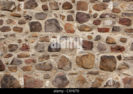 Une image de fond avec le détail d'un vieux mur traditionnel fabriqué à partir de pierres, de cailloux Banque D'Images