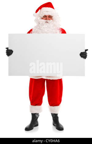 Photo de Santa Claus holding a blank sign, isolé sur un fond blanc avec l'exemplaire de l'espace pour ajouter votre propre message. Banque D'Images