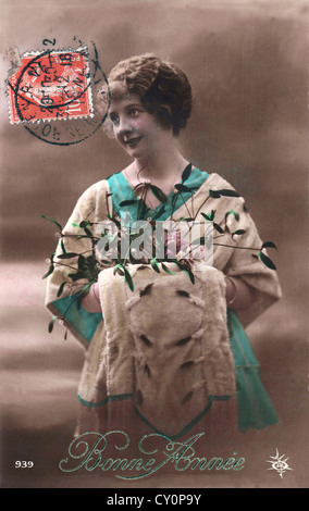 Vintage français holiday Greeting card 'Bonne Année' (Bonne année') avec une jeune femme Banque D'Images