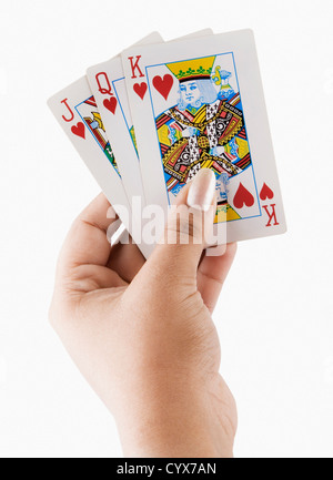 Close-up of a woman's hand holding playing cards Banque D'Images